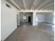 Open-concept living room featuring white brick accents and exposed beam ceiling at 3000 58Th S Ave, St Petersburg, FL 33712
