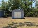 Outdoor storage shed with double doors provides ample space for tools and equipment at 3000 58Th S Ave, St Petersburg, FL 33712