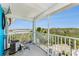 Cozy balcony with white railings overlooking lush greenery, offering a tranquil outdoor space at 3315 58Th S Ave # 605, St Petersburg, FL 33712