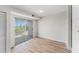 Bedroom featuring wood floors and a sliding glass door leading to a private balcony at 3315 58Th S Ave # 605, St Petersburg, FL 33712