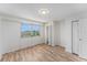 This bedroom features wood floors, a double window with a view, and a closet at 3315 58Th S Ave # 605, St Petersburg, FL 33712
