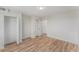 Bedroom with wood floors, three closets, and neutral walls at 3315 58Th S Ave # 605, St Petersburg, FL 33712