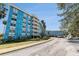 Condominium exterior featuring a unique architectural design with private balconies and lush landscaping at 3315 58Th S Ave # 605, St Petersburg, FL 33712