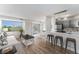 Stylishly furnished living space with wood floors, modern kitchen, and cozy seating area at 3315 58Th S Ave # 605, St Petersburg, FL 33712