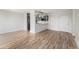 Open floor plan featuring wood floors and a modern kitchen with stainless steel appliances at 3315 58Th S Ave # 605, St Petersburg, FL 33712