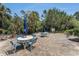 Charming brick patio with multiple seating areas surrounded by lush landscaping, perfect for outdoor gatherings at 3315 58Th S Ave # 605, St Petersburg, FL 33712
