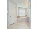 Bright bathroom with a soaking tub, glass-enclosed shower, and neutral finishes, creating a calming atmosphere at 33518 Castaway Loop, Wesley Chapel, FL 33543
