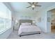 Cozy bedroom featuring a plush bed, soft lighting, and a soothing color scheme for a relaxing ambiance at 33518 Castaway Loop, Wesley Chapel, FL 33543