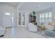 Spacious foyer featuring tile floors, natural light, and a seamless flow to other living spaces at 33518 Castaway Loop, Wesley Chapel, FL 33543