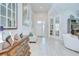 Welcoming foyer showcasing neutral tones, decorative accents, and access to multiple living areas at 33518 Castaway Loop, Wesley Chapel, FL 33543