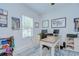 Organized home office with a large desk, dual monitors, and inspirational wall decor at 33518 Castaway Loop, Wesley Chapel, FL 33543