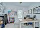 Bright office featuring a large desk, printer, exercise equipment and inspirational wall art at 33518 Castaway Loop, Wesley Chapel, FL 33543