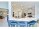 Bright kitchen showcases modern appliances, a spacious island with seating, and an open layout to the dining area at 33518 Castaway Loop, Wesley Chapel, FL 33543