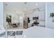Open kitchen design with stainless steel appliances, breakfast nook and light grey cabinets at 33518 Castaway Loop, Wesley Chapel, FL 33543