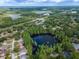 Panoramic aerial shot revealing a community with lake views near the highway at 3428 Valley Ranch Dr, Lutz, FL 33548