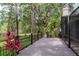 A spacious back deck offers serene views of the fenced-in backyard and lush landscaping at 3428 Valley Ranch Dr, Lutz, FL 33548