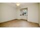 Bright bedroom with neutral tones, tiled floor, a ceiling fan and a large window at 3428 Valley Ranch Dr, Lutz, FL 33548