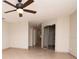 Bright and airy bedroom with tile floors and ample closet space, offering a serene and organized retreat at 3428 Valley Ranch Dr, Lutz, FL 33548
