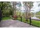 Back deck with lawn and water view at 3428 Valley Ranch Dr, Lutz, FL 33548