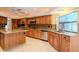 Bright kitchen with a center island, stainless steel appliances and granite counters at 3428 Valley Ranch Dr, Lutz, FL 33548