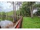 Enjoy waterfront living with lush lawn leading to a serene lake at 3428 Valley Ranch Dr, Lutz, FL 33548