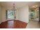 Inviting living room with hardwood floors, bay window, and elegant chandelier at 3428 Valley Ranch Dr, Lutz, FL 33548