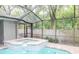 Backyard spa inside a covered pool area at 3428 Valley Ranch Dr, Lutz, FL 33548