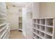 Organized walk-in closet with ample shelving, drawers, and hanging space for clothing and storage at 3428 Valley Ranch Dr, Lutz, FL 33548