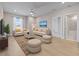 Inviting living room with ample seating, stylish decor, and hardwood floors for a cozy atmosphere at 34307 Radley Way, Wesley Chapel, FL 33545