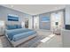 Spacious main bedroom with plush rug, ensuite bath and plenty of bright light at 34307 Radley Way, Wesley Chapel, FL 33545