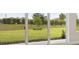 Views from inside the home showing a beautiful green and spacious backyard with large sliding glass doors at 3818 Farm Garden Ct, Lakewood Ranch, FL 34211