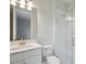 Bathroom with glass-enclosed shower and vanity with integrated sink at 3818 Farm Garden Ct, Lakewood Ranch, FL 34211