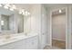 Bathroom featuring double vanity and tile flooring with an access to walk-in closet and toilet at 3818 Farm Garden Ct, Lakewood Ranch, FL 34211