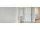 Neutral hallway with view of bedroom and bathroom at 3818 Farm Garden Ct, Lakewood Ranch, FL 34211