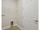 Small laundry room with overhead storage at 3818 Farm Garden Ct, Lakewood Ranch, FL 34211