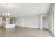 Spacious open-concept living room and kitchen with wood floors and recessed lighting at 3818 Farm Garden Ct, Lakewood Ranch, FL 34211
