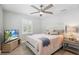 Bedroom with a comfortable bed, large window, ceiling fan, and plenty of space to unwind at 4027 25Th N Ave, St Petersburg, FL 33713