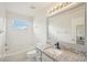 Bright bathroom featuring a tub with shower, granite countertop, and a neutral color palette at 4224 Fleewell Ct, Valrico, FL 33596
