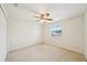 Light, airy bedroom featuring a ceiling fan and bright window at 4224 Fleewell Ct, Valrico, FL 33596