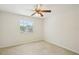 Bright bedroom with ceiling fan and backyard view at 4224 Fleewell Ct, Valrico, FL 33596