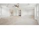 Large bedroom with tray ceilings and carpeted floors at 4224 Fleewell Ct, Valrico, FL 33596
