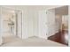 Neutral bedroom with white walls, carpet, and a doorway to a bathroom at 4224 Fleewell Ct, Valrico, FL 33596