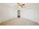 Bedroom with closet, ceiling fan and door to adjoining space at 4224 Fleewell Ct, Valrico, FL 33596