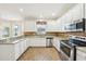 Kitchen features granite counters, stainless steel appliances and tile flooring at 4224 Fleewell Ct, Valrico, FL 33596
