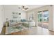 Bright living room features tile floors, ceiling fan, and sliding glass doors at 4224 Fleewell Ct, Valrico, FL 33596