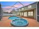 Inviting screened-in pool and spa area featuring a fountain, perfect for relaxation and entertainment at 4224 Fleewell Ct, Valrico, FL 33596