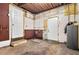 Basement with concrete floor, exposed ceiling, and two white doors at 5015 15Th S Ave, Gulfport, FL 33707