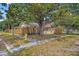 View of a quaint home shaded by a large tree at 5015 15Th S Ave, Gulfport, FL 33707