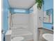 Bright bathroom with a shower-tub combo and a well-lit mirror at 520 Canal Way, Oldsmar, FL 34677