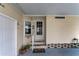 Welcoming carport entrance featuring a white door, window, and steps to the main door at 520 Canal Way, Oldsmar, FL 34677